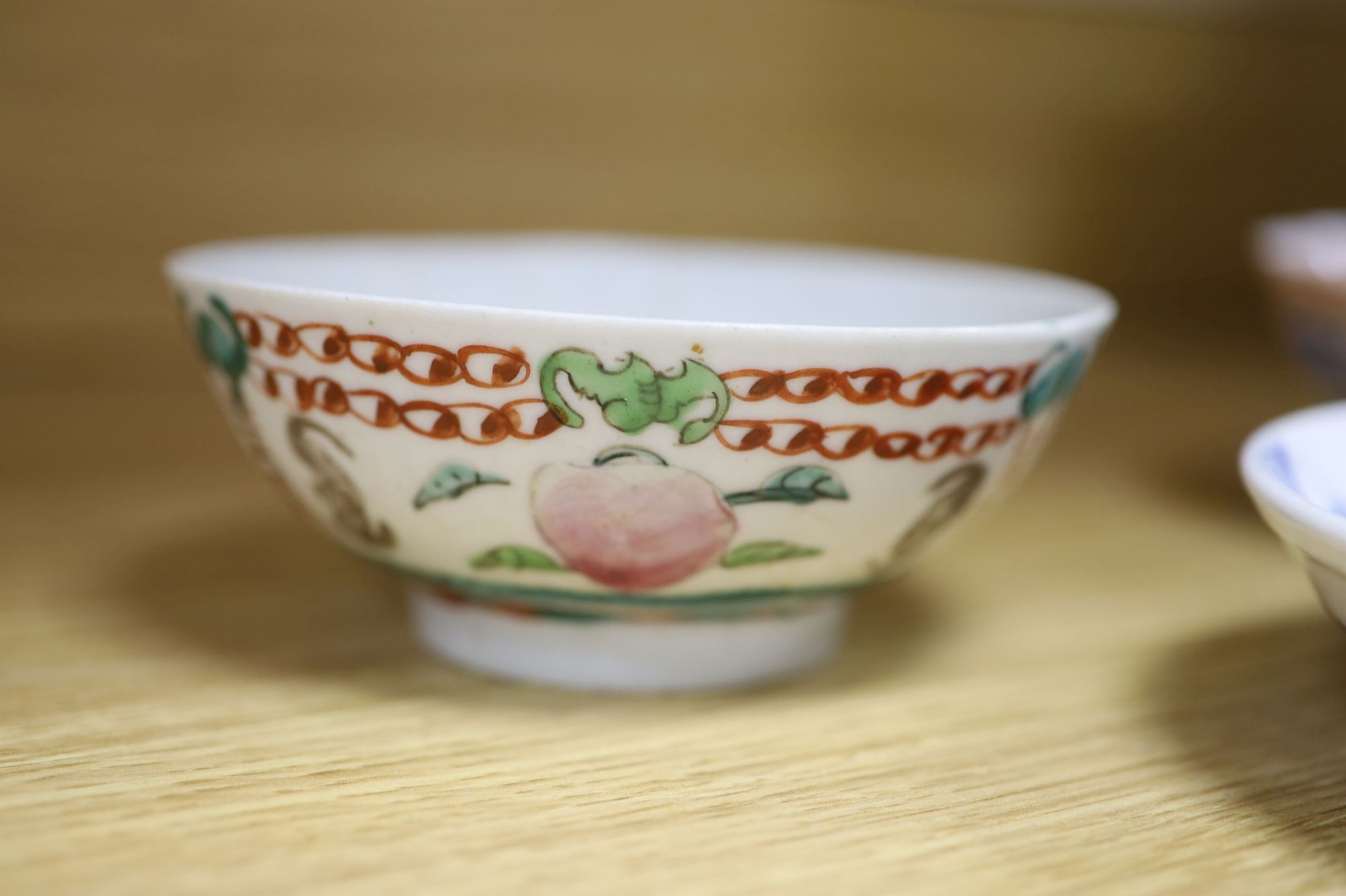 A quantity of Chinese and Japanese ceramics, including a blue and white dragon dish, a Cantonese famille rose dish, four cloisonne pi